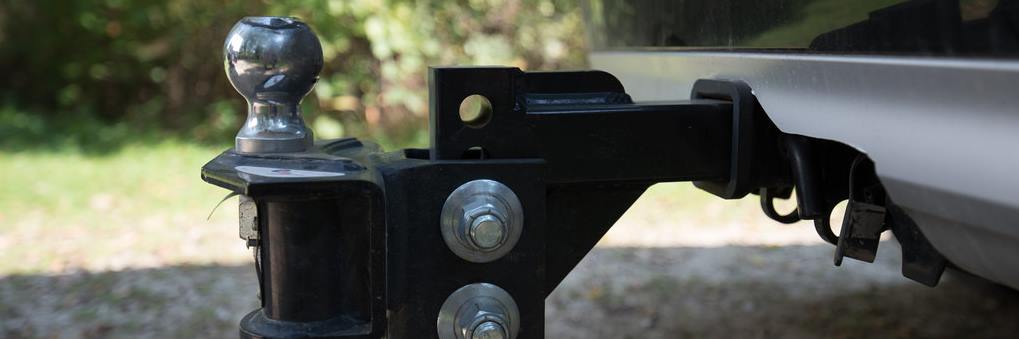 Weight-distributing hitch with spring bars installed on a travel trailer
